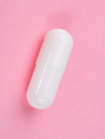White Pill on Pink Background