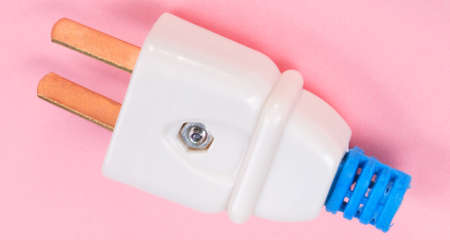 American Outlet Plug on pink backgroundの写真素材