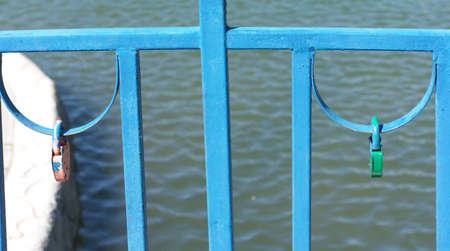 railing over pond at dry sunny summer day