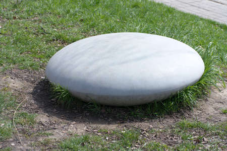 round stone in park at dry sunny summer dayの写真素材