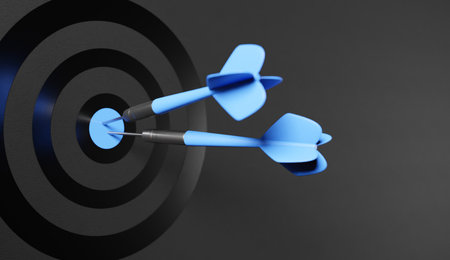 Dart arrow on center of dartboard, metaphor to target success, winner concept,competitive advantage, strategic marketing concept, 3D renderの写真素材