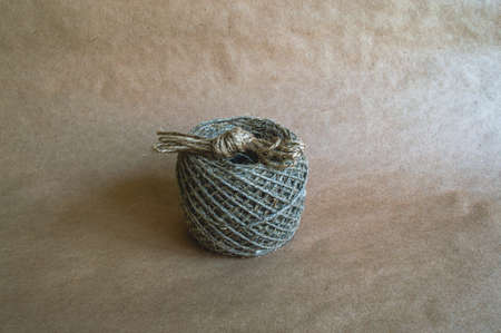 Skein of linen thread isolated on vintage background