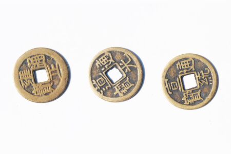 Three coins on white backgroundの写真素材