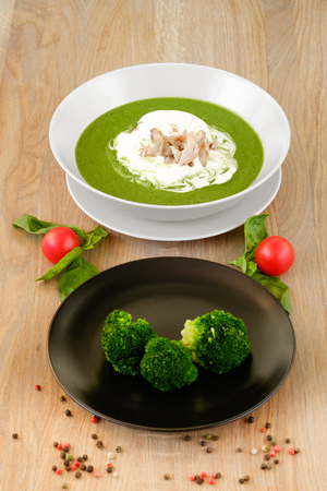 ? plate of tasty hot soup with broccoliの写真素材