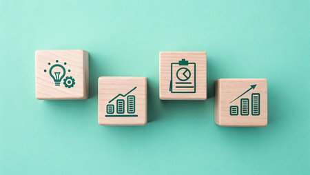 Business concept image of wooden cubes with icons on them over green background