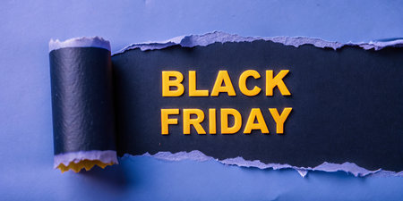 Black Friday text on torn paper. Business concept for Black Friday sale advertising campaignの写真素材