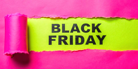 Black friday text on torn paper with space for your text.の写真素材