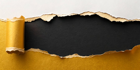 Torn paper with space for your message on a black background.の写真素材