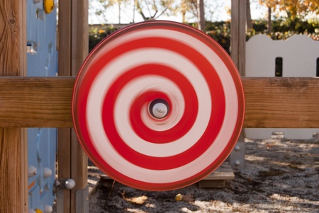 Fun red spiral rotating in a playpen の写真素材