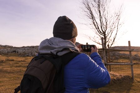 portrait of a man taking a picture with a mobile