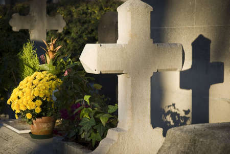 Grave with cross at cemeteryの写真素材