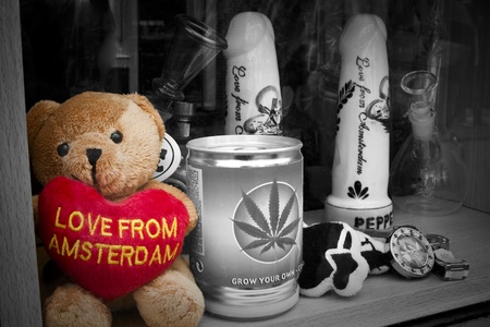 Dutch Love from Amsterdam bear souvenir standing in shopping window with penis and tin with weed in B Wのeditorial素材