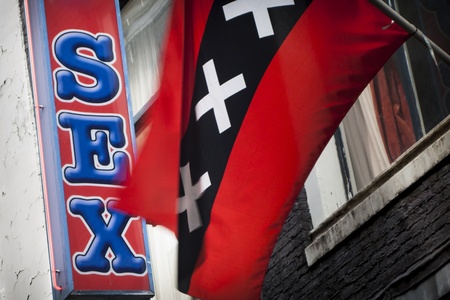 Red light district sex sign with Amsterdam flagの写真素材