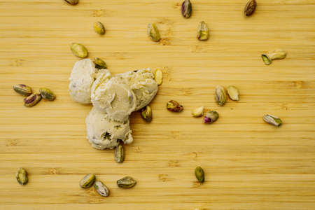 pistachio icecream scoop wood tableの写真素材