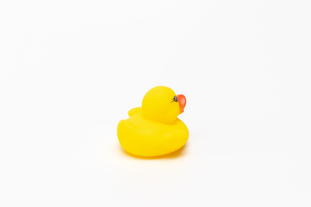 isolated yellow rubber duck on whiteの写真素材
