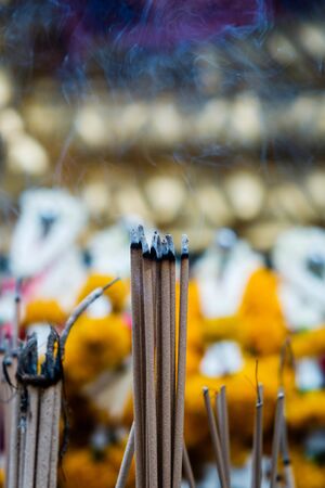 Incense sticks in buddhist temple in Bangkok, worshipの写真素材