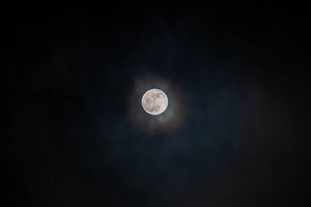 Full moon black background with clouds detail surface