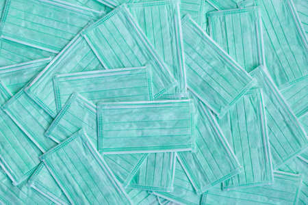 Medical mask background green cyan color. Inmunity passport, health and surveillance concepts.の写真素材