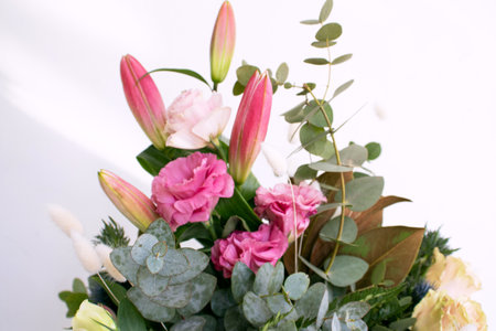 Bouquet of pink lilies and eucalyptusの写真素材