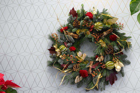 Christmas wreath on a background with a pattern of geometric shapesの写真素材