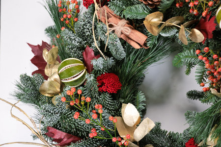 Beautiful Christmas wreath with decorations on white background, closeupの写真素材