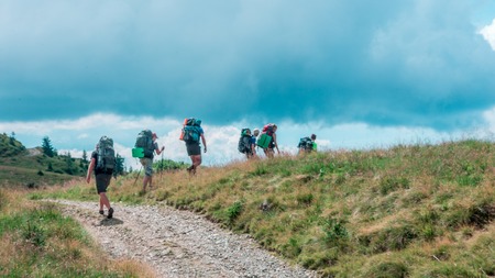 Group of tourists going with bagsの写真素材
