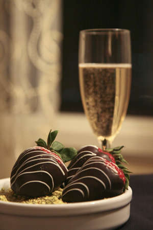 Champagne and chocolate covered strawberriesの写真素材
