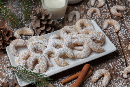 Vanille cookies and milk on a wooden tableの写真素材