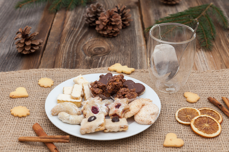 Christmas cookies on a wooden table with tea and cinnamonの写真素材