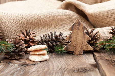 Christmas cookies on a wooden table with tea and cinnamonの写真素材