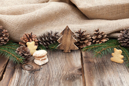 Christmas cookies on a wooden table with tea and cinnamonの写真素材