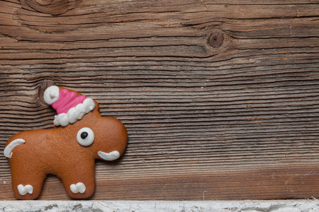 Gingerbread man and reindeer in front of their christmas tree