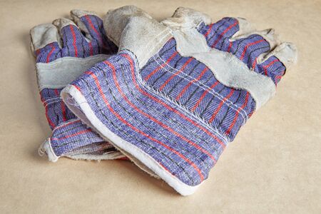 Working gloves on old paperの写真素材