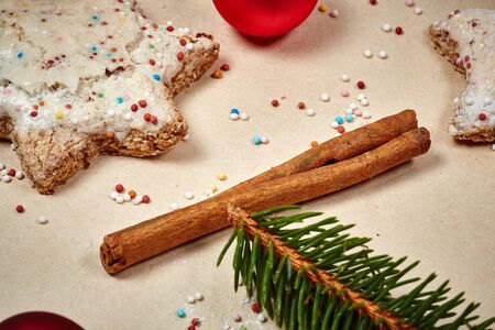Christmas cookies and balls and fir branch closeupの写真素材