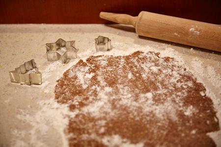 A dough and a rolling pin in the kitchenの写真素材