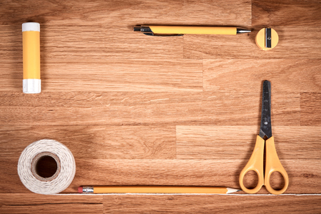 Cord, string, pencil, pen and sharpener on brown wooden oiled oak tableの写真素材