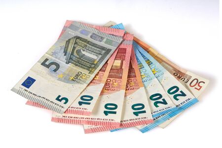Isolated european euro banknotes on a white table as backgroundの写真素材