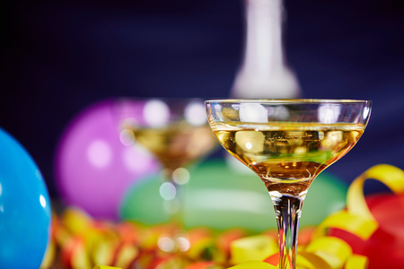 happy new year party with balloons and champagne and paper streamersの写真素材