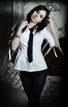 The girl with at an old wall.の写真素材