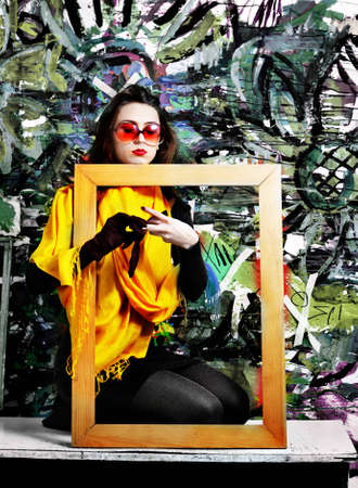 The girl on the abstract background.の写真素材