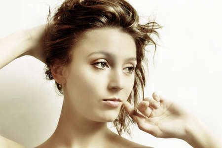 The girl doing up hairの写真素材