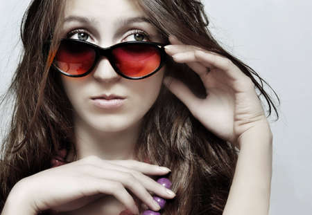 The girl in sunglasses and a beadsの写真素材