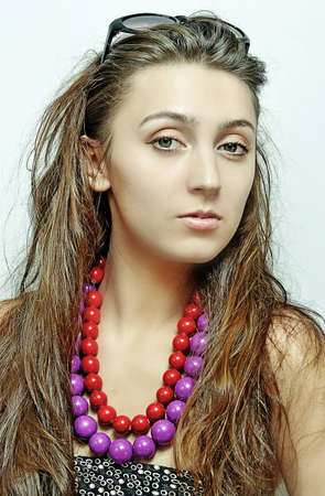 The girl in sunglasses and a beadsの写真素材