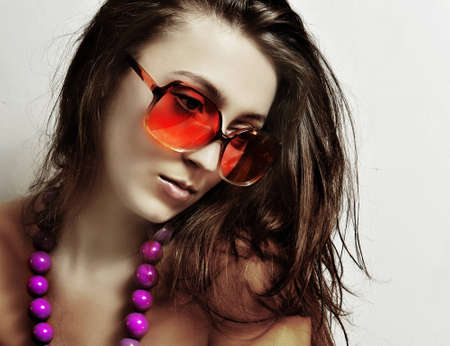 The girl in sunglasses and a beadsの写真素材