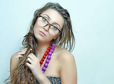 The girl in  glasses and a beadsの写真素材