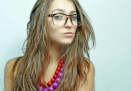 The girl in  glasses and a beadsの写真素材