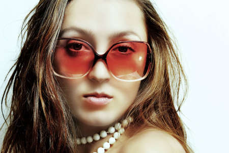 The girl in  glasses and a beadsの写真素材