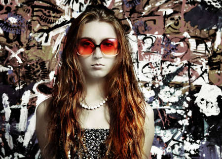 The girl in sun glasses and  beadsの写真素材