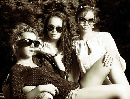 Fashion portrait of a beautiful young sexy woman wearing sunglassesの写真素材