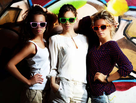 Fashion portrait of a beautiful girls wearing sunglassesの写真素材